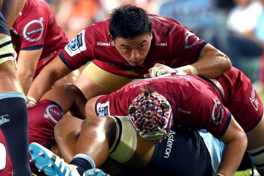Ayumu Goromaru of the Queensland Reds looks over the top of a ruck during a Super Rugby match against the Waratahs in Sydney in February. The Rugby World Cup hero from Japan will face his country’s new Super 18 franchise Sunwolves this weekend in Brisbane. Photos: AFP