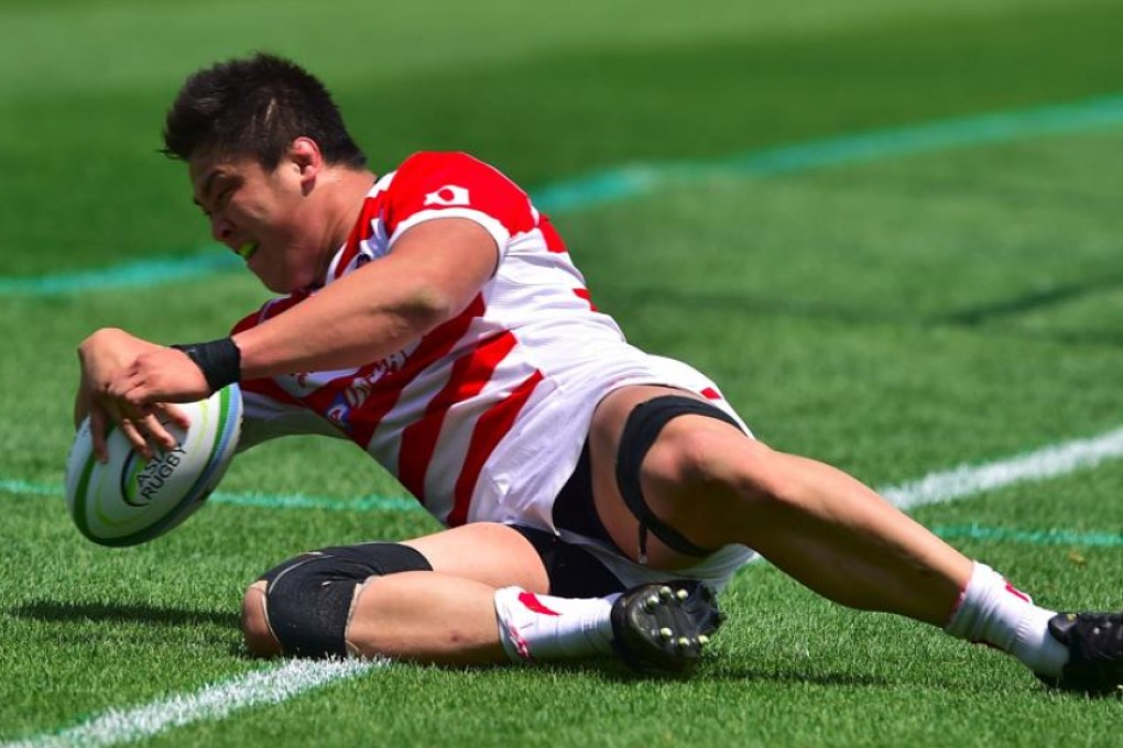 Naohiro Kotaki crosses over to score one of Japan’s nine tries (not including a second-half penalty try) in their 60-3 win over South Korea in the Asia Rugby Championship on Saturday. Photo: AFP