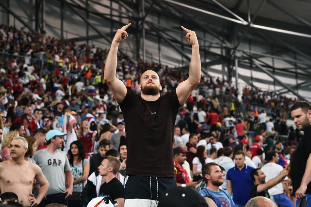 A Russian hooligan lets his feelings known. Photo: AFP