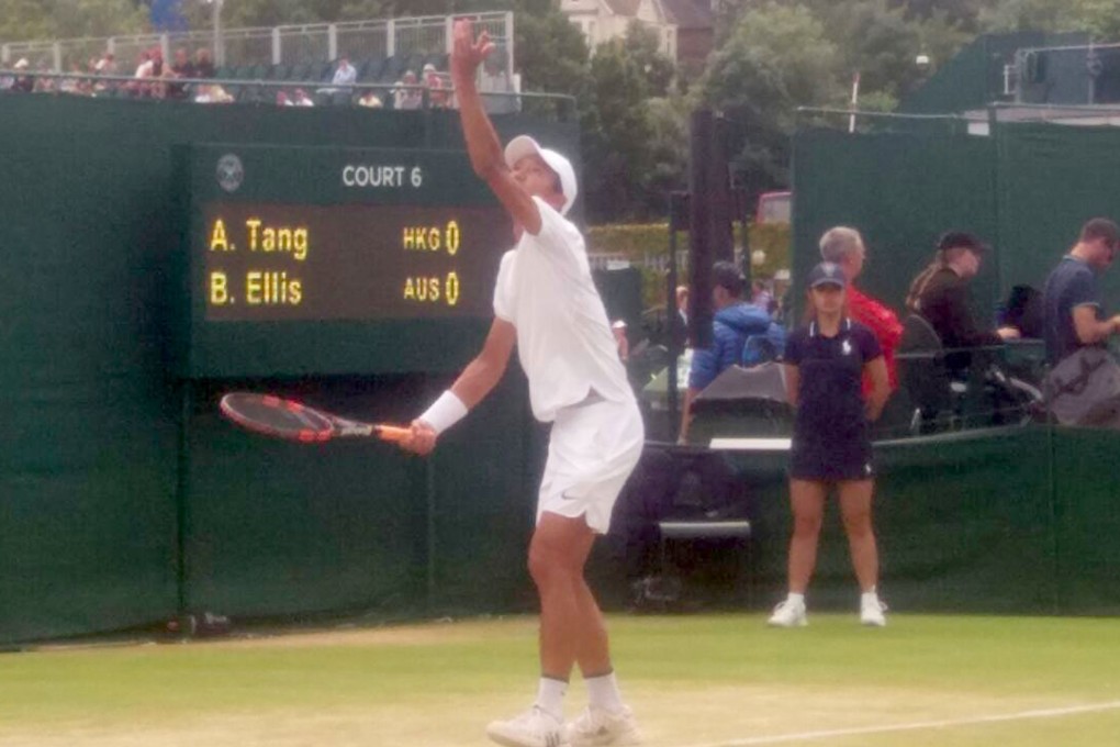 Jackie Tang serves at Wimbledon