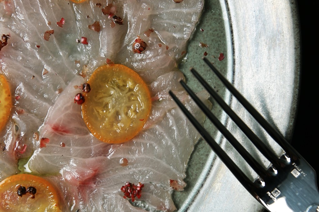 Hamachi carpaccio with kumquat oil and pink peppercorn. Photo: Jonathan Wong
