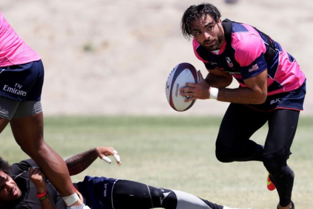 New England patriots defensive back Nate Ebner runs with the ball during a Team USA rugy sevens training session at the Olympic Center in Chula Vista, California on Friday. Photos: AFP
