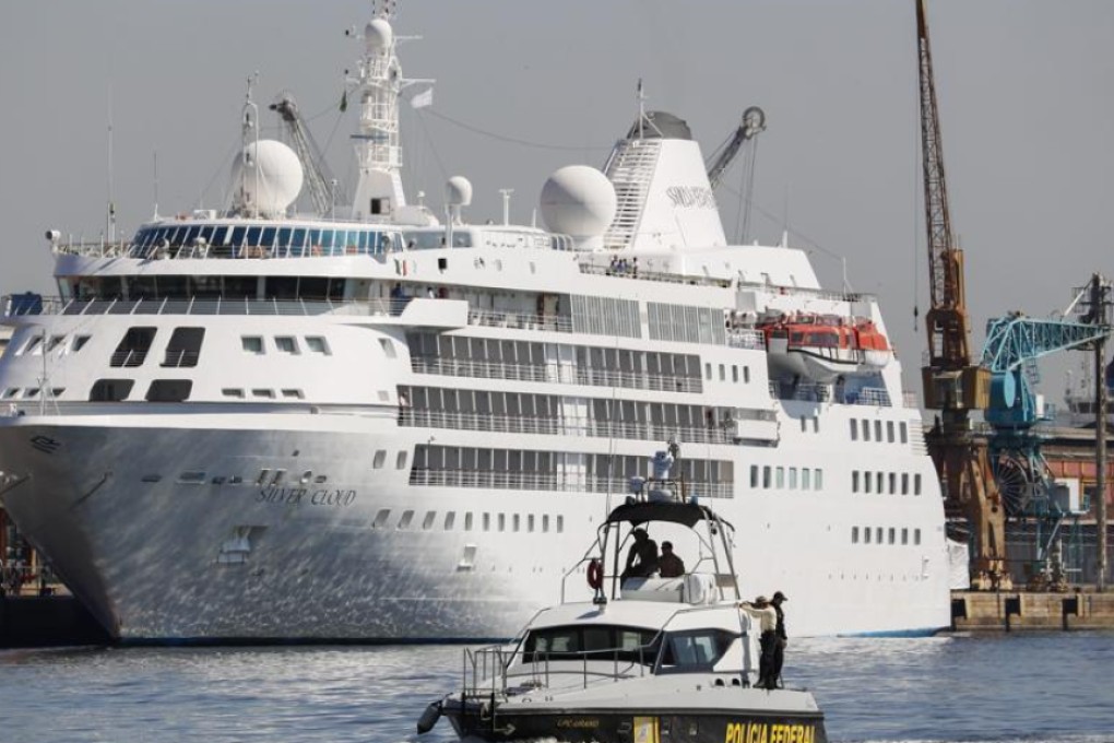 Federal police patrol in front of the Silver Cloud cruise ship in Rio where the US men’s and women’s basketball teams are staying during the course of the Olympics. Photo: EPA
