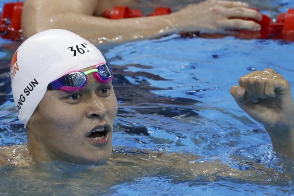 Sun Yang of China pumps his fist as he finishes first in his heat to qualify fourth overall for the Rio Olympics 400m freestyle final. Photo: Reuters