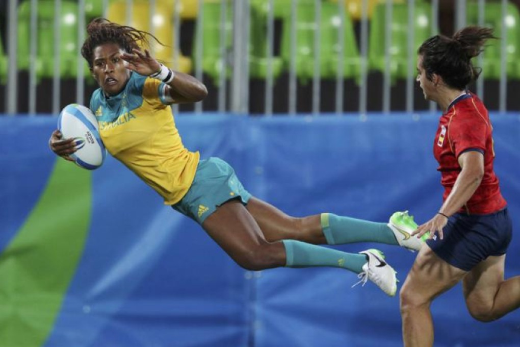 Australia’s Ella Green flies in to score against Spain a women’s rugby sevens quarter-final match against in Rio on Sunday. Photo: Reuters