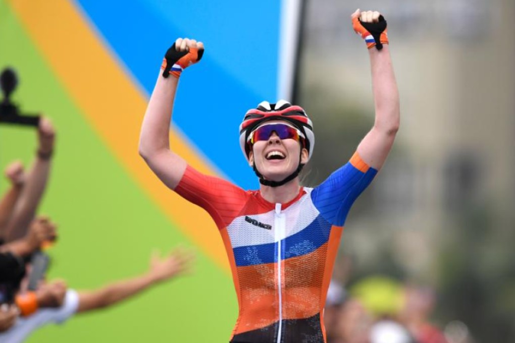 Anna van der Breggen of the Netherlands crosses the finish line at Copacabana beach on Sunday to win the women’s cycling road race. Photo: AFP