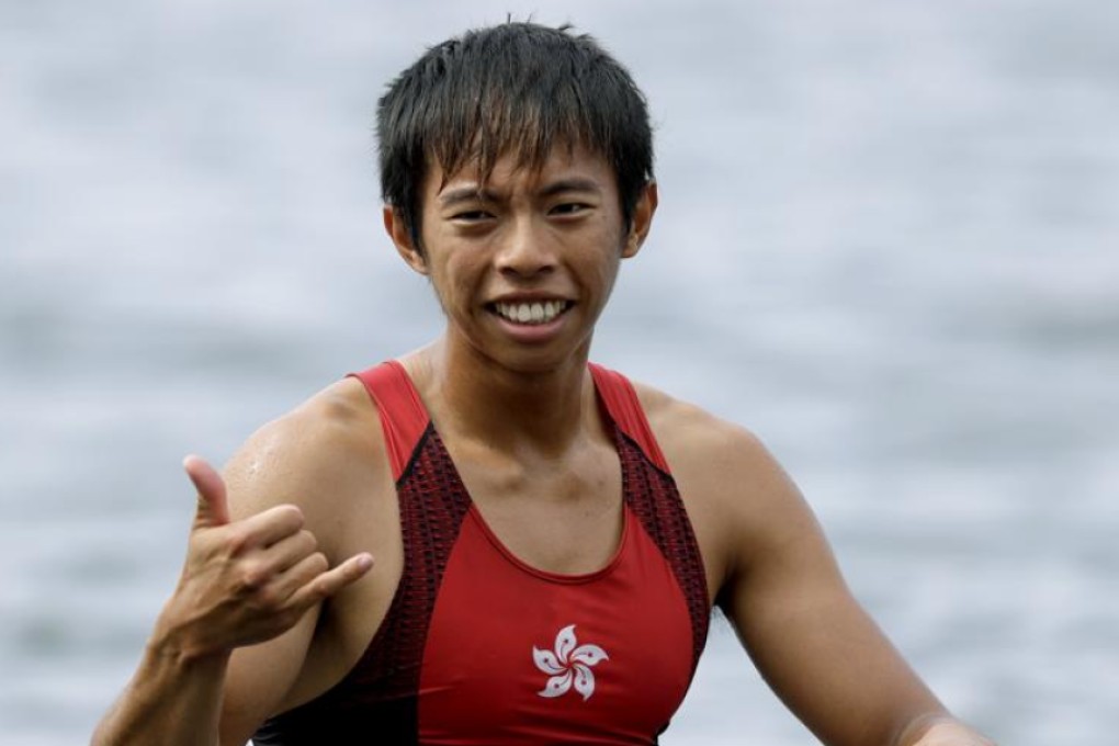 Chiu Hin-chun of Hong Kong gestures as he rows to shore after competing in the men’s rowing lightweight double sculls heats on Monday. Photo: AP