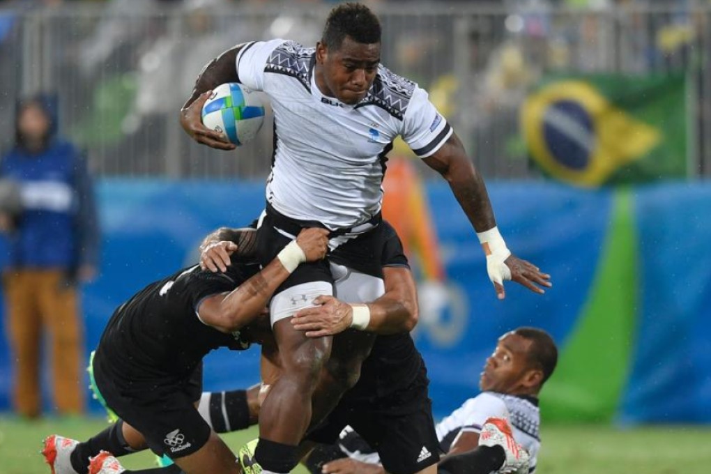 Josua Tuisova carries the ball into battle for Fiji in their 12-7 quarter-final victory over New Zealand on Wednesday. Photo: AFP