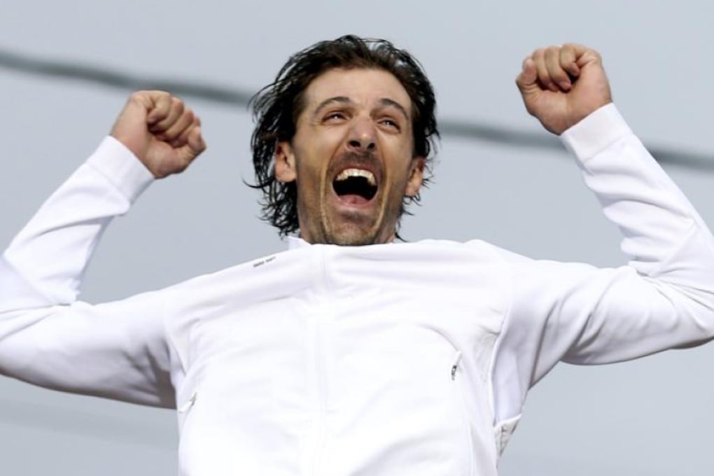 Gold medal winner Fabian Cancellara of Switzerland shows his delight at the awards ceremony in Rio on Wednesday. Photos: Reuters