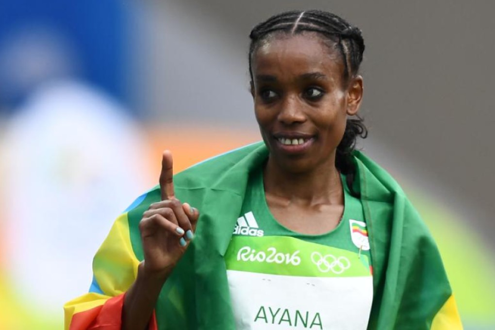 Ethiopia’s Almaz Ayana celebrates after she broke the world record to win the women's 10,000m race during the athletics event at the Rio 2016 Olympic Games in Rio de Janeiro on Friday. Photo: AFP