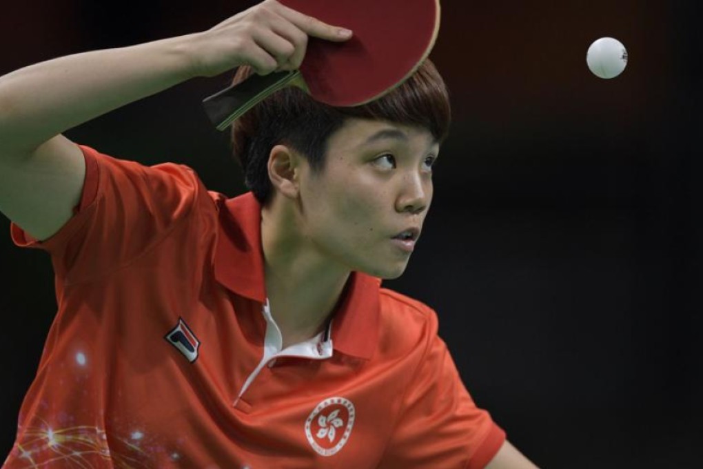 Hong Kong’s Doo Hoi-kem eyes the ball as she serves against Taiwan’s Chen Szu-yu in their women’s team qualification table tennis match at Riocentro on Friday. Photo: AFP