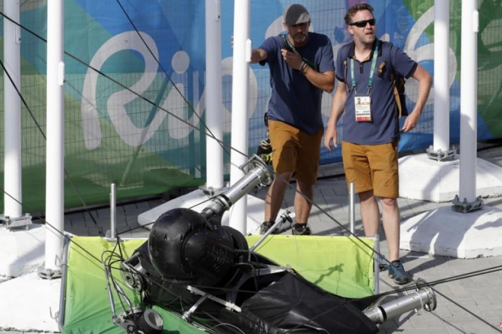 An overhead camera that fell from wires suspending it over Olympic Park lays on the ground at the Summer Games in Rio de Janeiro, Brazil on Monday. Photo: AP