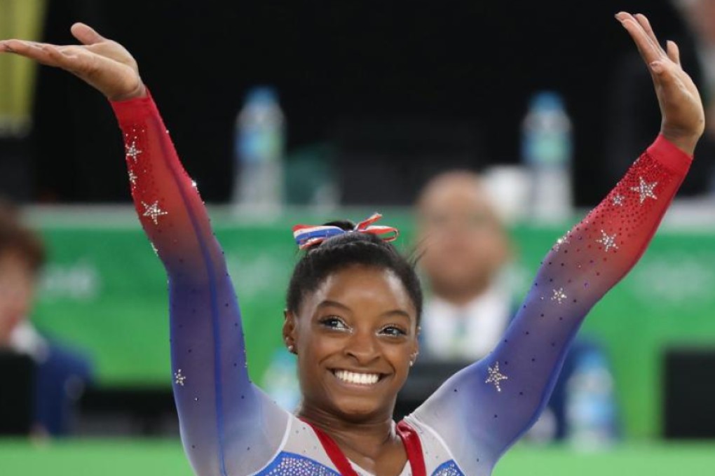 Gymnastics powerhouse Simone Biles clinches record-equalling 