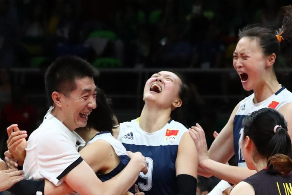 Coach Lang Ping celebrates with the China women’s volleyball team after their stunning upset win over Brazil in the quarter-finals. Photo: Reuters