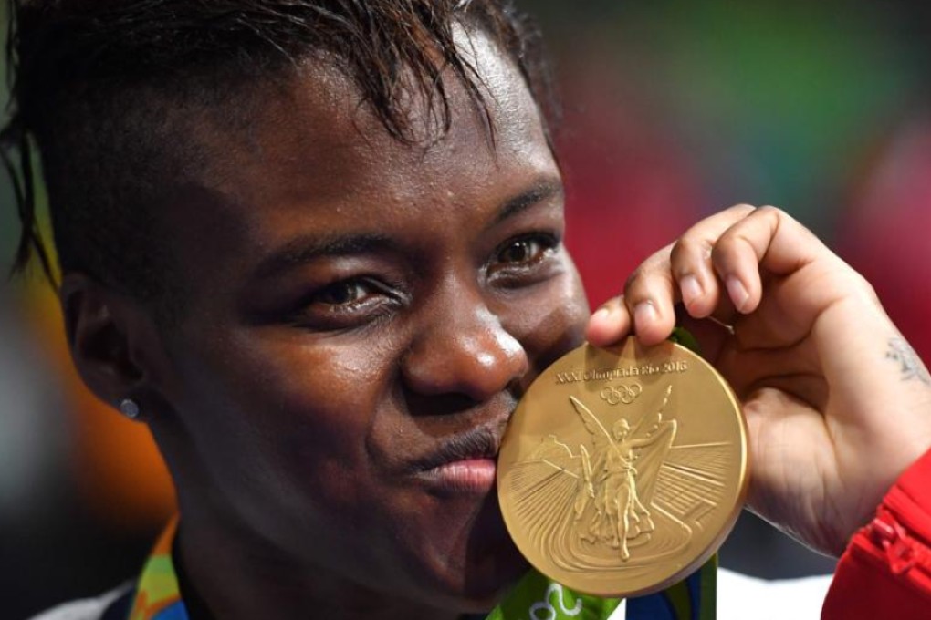 Great Britain’s Nicola Adams poses on the podium with her gold medal after she won the women’s flyweight division at Riocentro on Saturday. Photo: AFP
