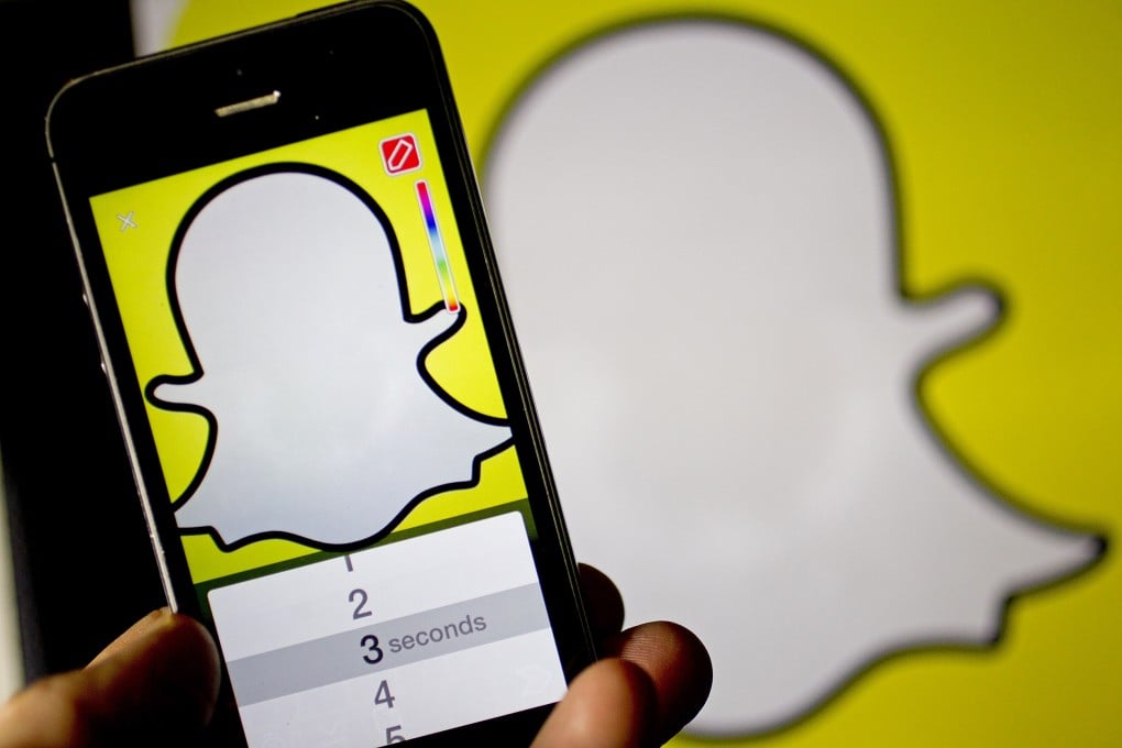 The Snapchat app is displayed on an Apple iPhone 5s. Photo: Andrew Harrer/Bloomberg/Getty Images