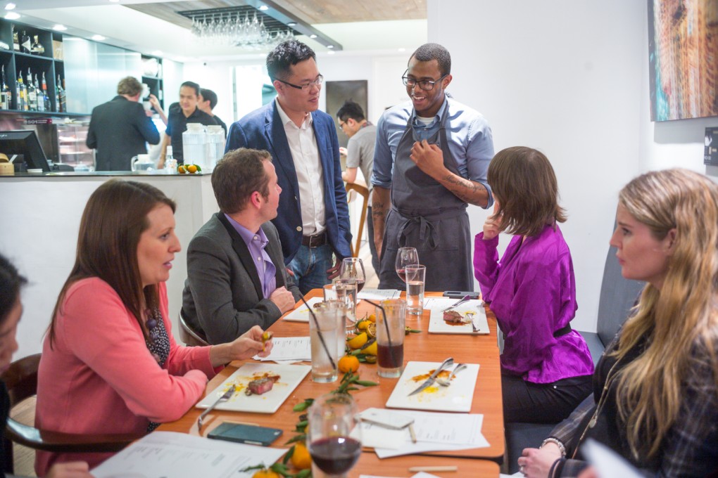 Test Kitchen founder Vincent Mui (standing, left) and Top Chef contestant Kwame Onwuachi (standing, right) partnered for a pop-up dinner in March last year. Photo: Supplied
