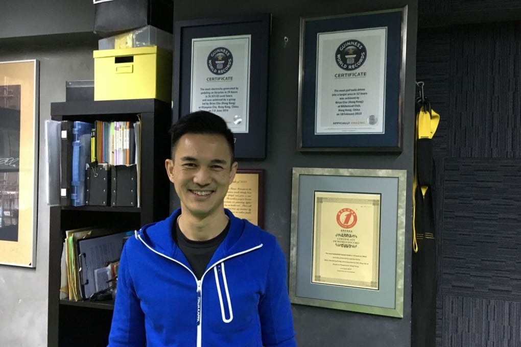 Brian Cha stands in front of his Guinness World Records. Photo: Isabelle Hon