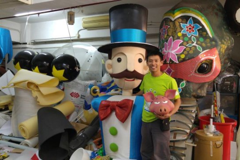 Chan stands with his favorite puppet, The Magician