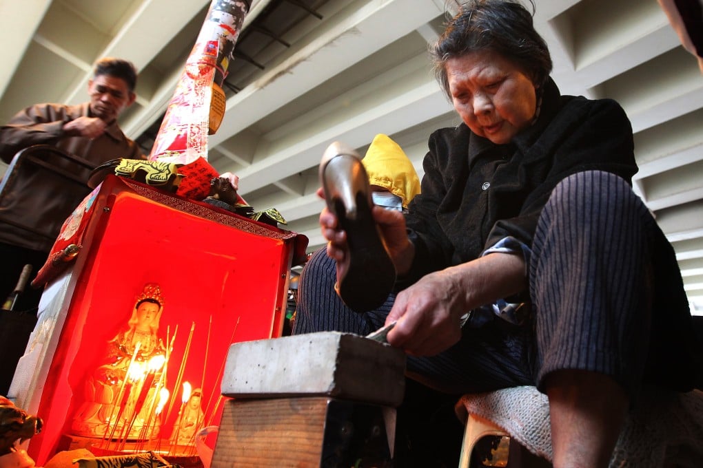 A "villain-hitter" gets to work. Photo: Edward Wong/SCMP