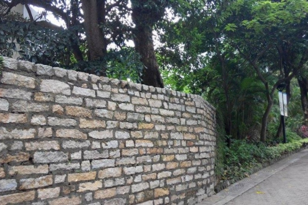 The affected 150-year-old historic boundary wall of the Flagstaff House.