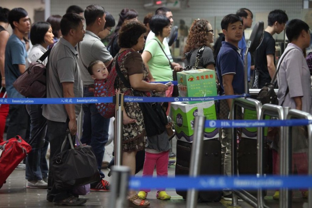 Mainland Chinese tourists pictured at the border