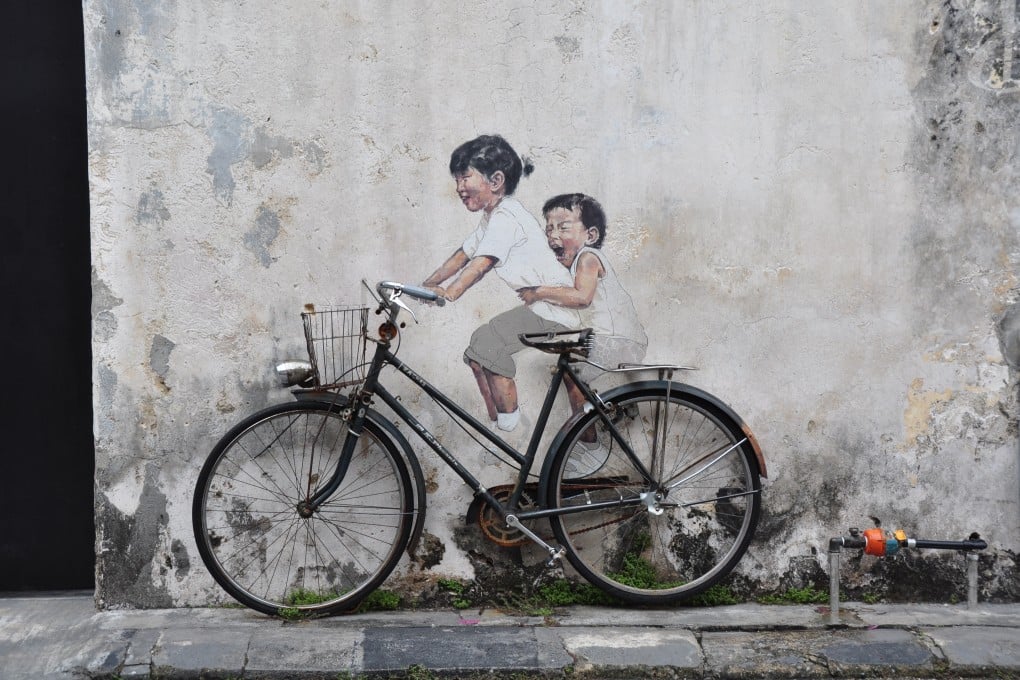 See Ernest Zacharevic's colorful murals scattered across the city. (Photo: Marufish/Flickr)