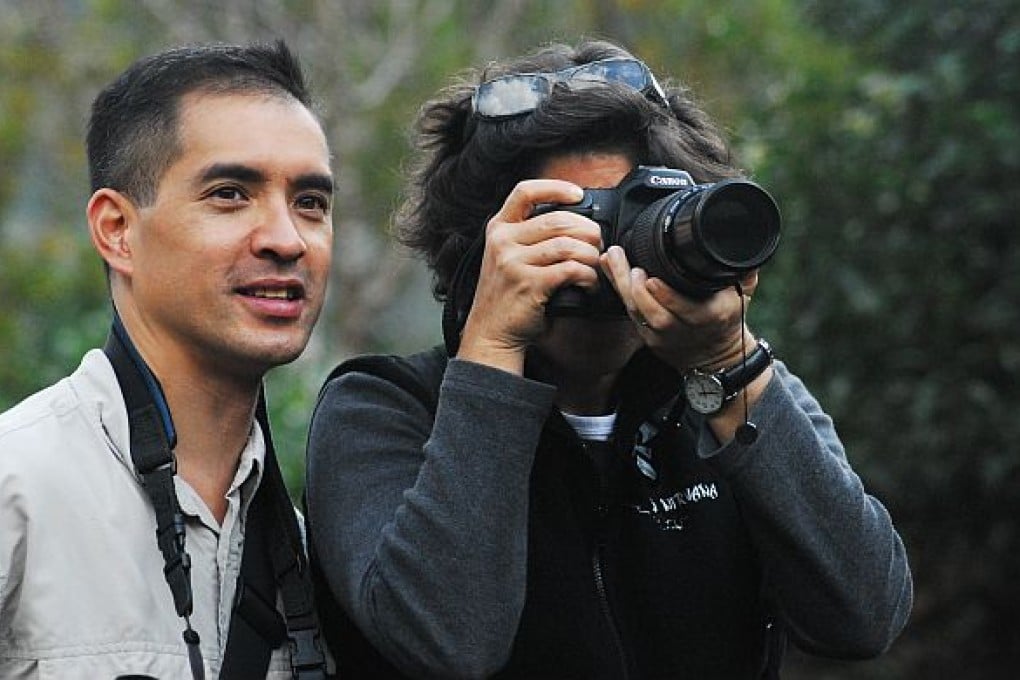 Ron Yue working with a traveller in Yuanyang