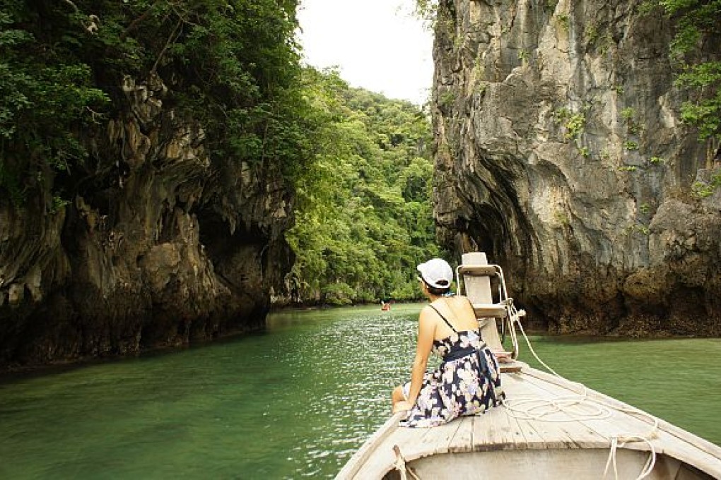A longtail boat approaches Koh Hong