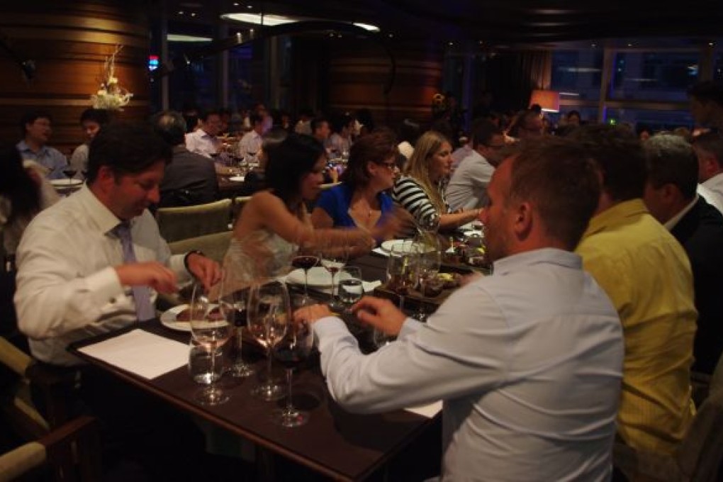 Diners trying to decide which steak they like best.