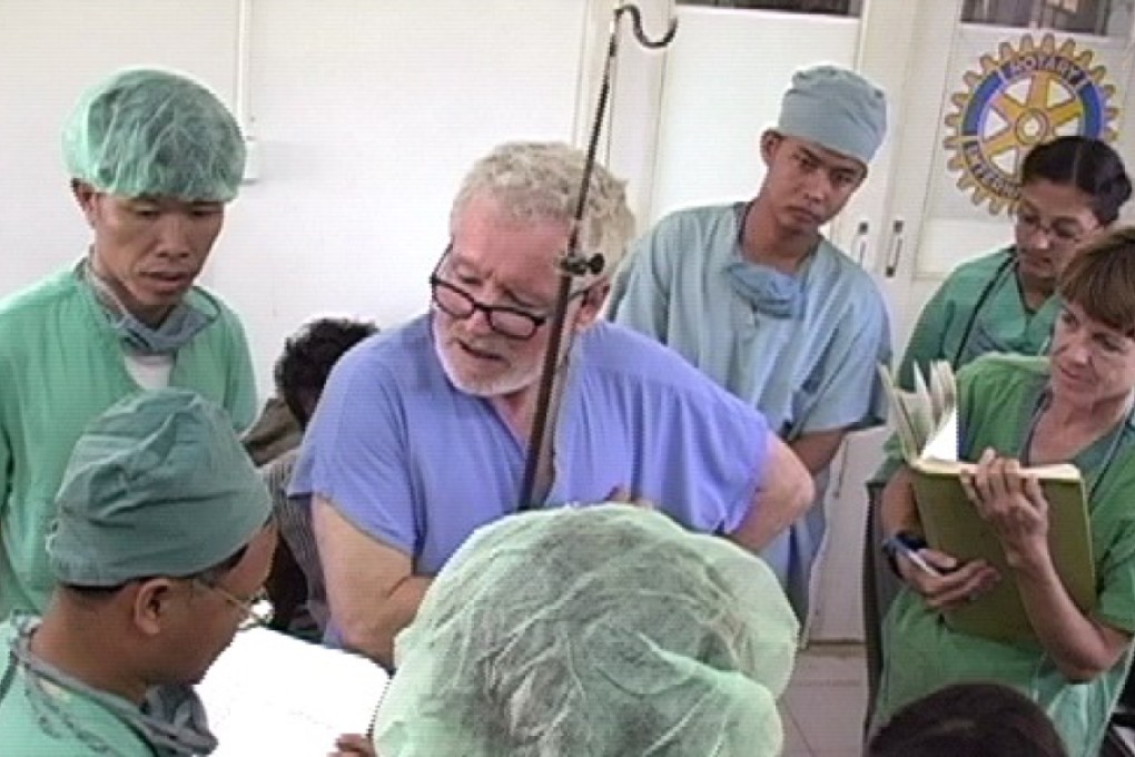 Dr James Gollogly talks to other volunteer medics at the Kien Khleang centre. Photo: Rose Charities