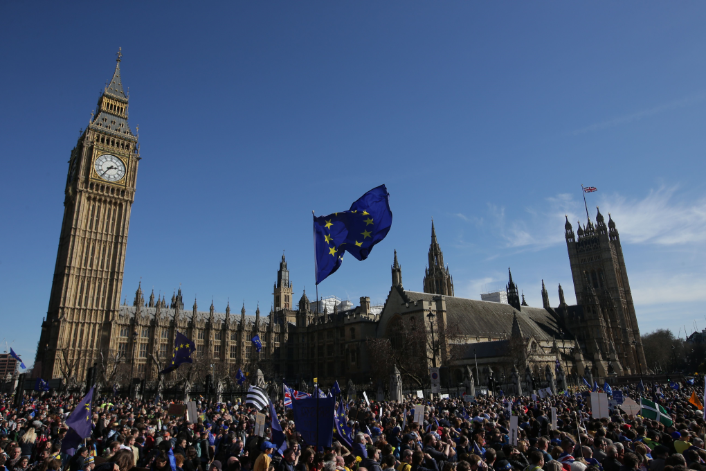 A demonstrator flies an EU flag outside the Houses of Parliament, during a rally following an anti Brexit, pro-European Union (EU) march in London, ahead of the British government's planned triggering of Article 50. Photo: AFP/Daniel LEAL-OLIVAS