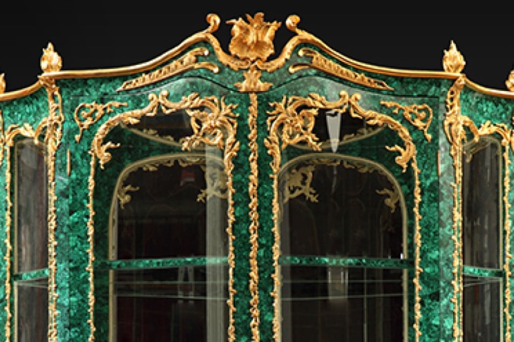 JOSEPH-EMMANUEL ZWIENER (1849-1900) Universal Exhibition 1878 in Paris A malachite Display Cabinet Ornamentation of sculpted, chiseled and gilt bronze. H 260; W 140 cm. (H 102,5; W 55 in.) Provenance: Comte de Montaigne de Poncins