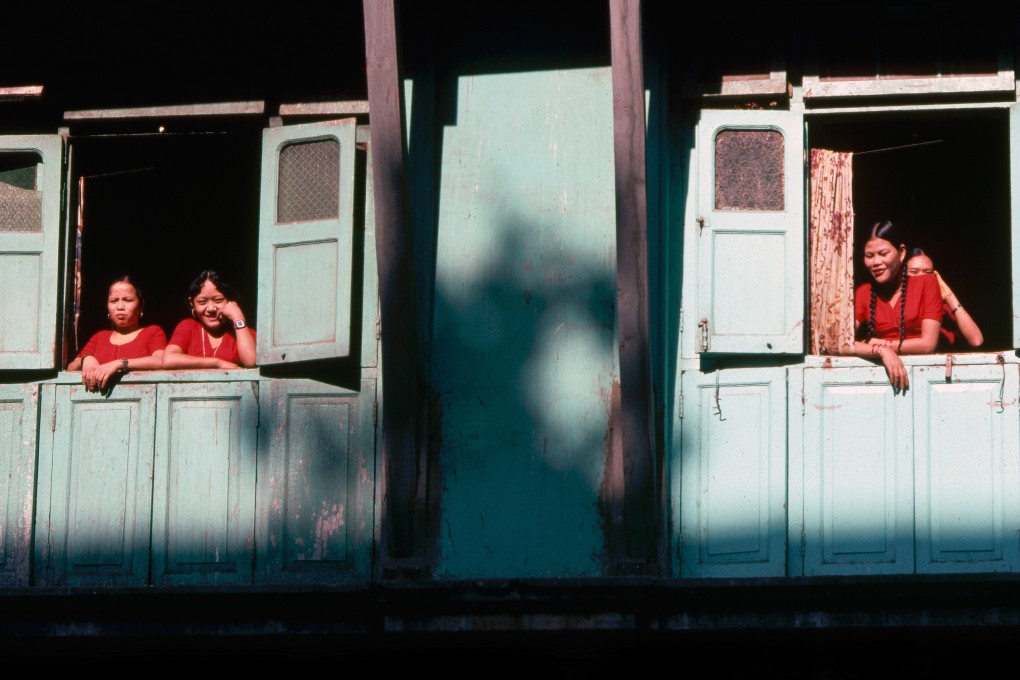 Nepalese prostitutes at a Mumbai brothel keep a lookout for clients. India and the Middle East are the most common destinations for women and children sold from the impoverished country to traffickers. Photo: Ivan Broadhead