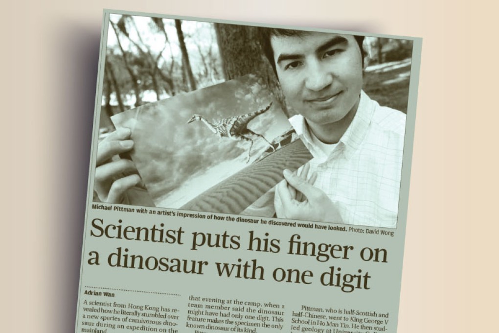 Scientist puts his finger on a dinosaur with one digit