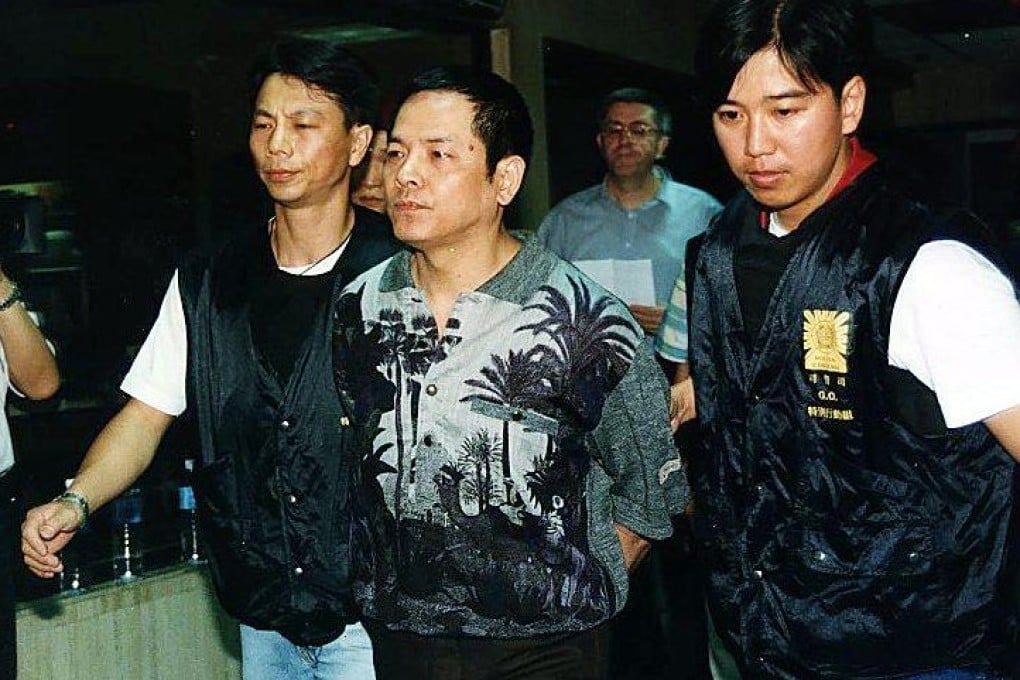 Wan Kuok-koi is escorted by Macau Police to court in 1998. Photo: Handout