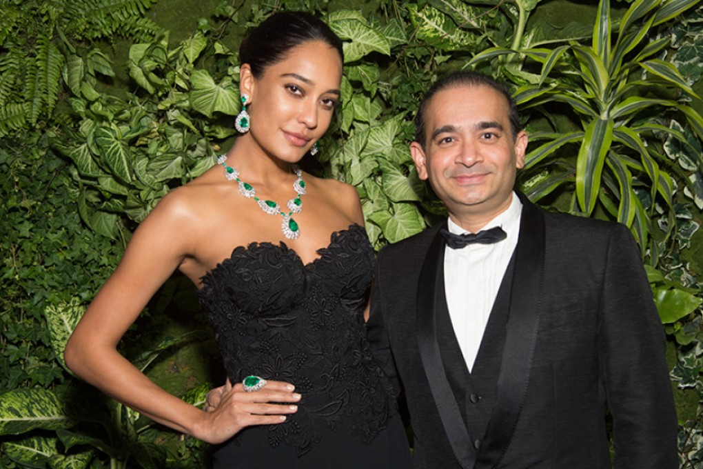 Lisa Haydon wears the Emerald Waterfall Suite featuring bright green Colombian emeralds and Jasmine Cut® diamonds at the La Biennale Paris with Nirav Modi.