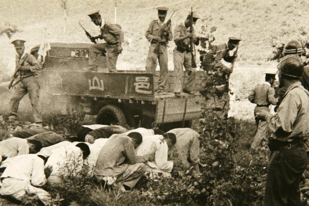 A US Army photo shows South Korean troops and police executing political prisoners in Daejeon, South Korea, in 1950. Photo: AP