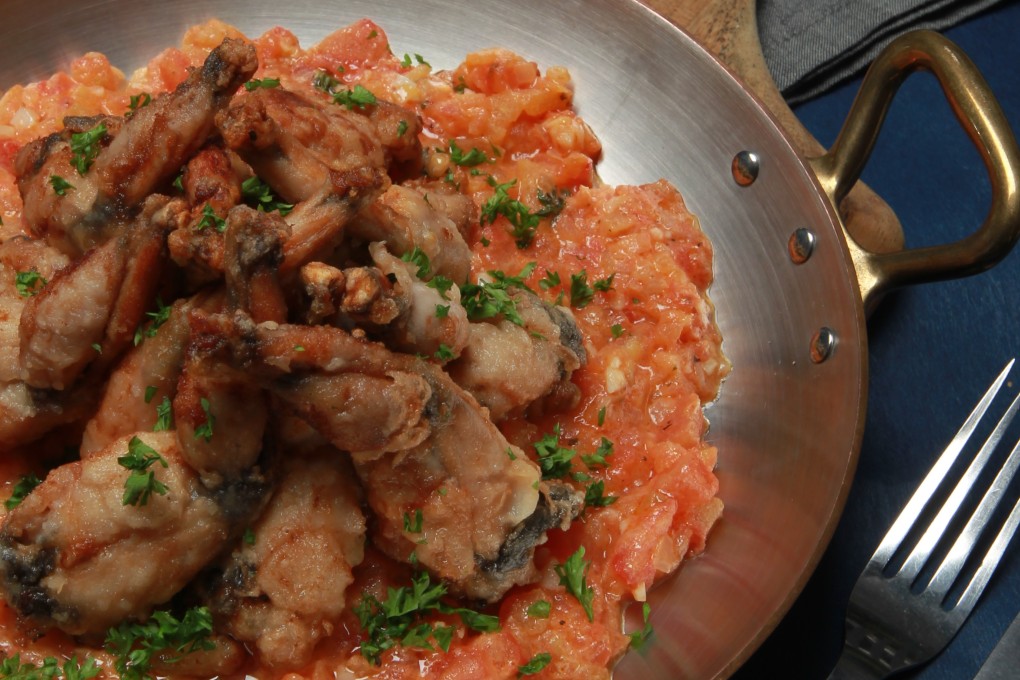 Sauteed frog legs with tomato concasse and mushy peas. Photo: Jonathan Wong