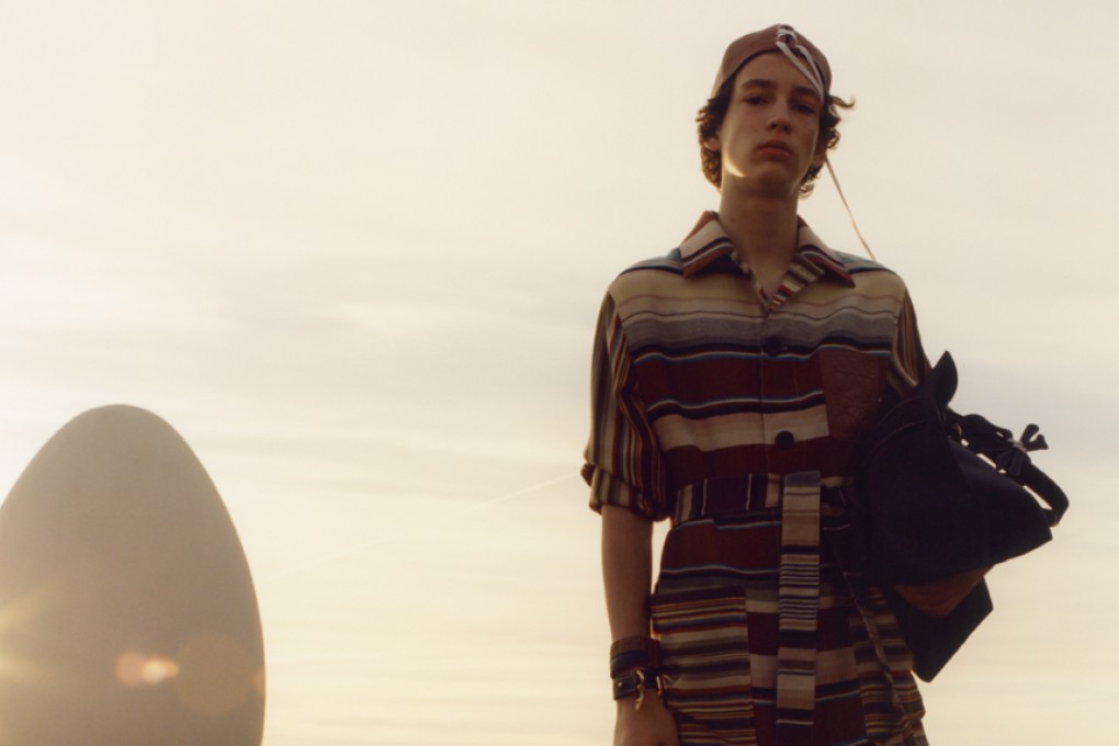 Striking multicolour striped buttoned and belted coat with fringed edges is the season’s must-have.