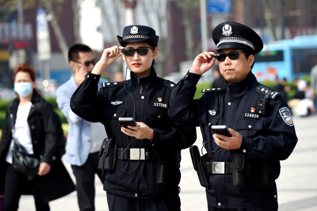 Police officers with AI-powered smart glasses in the central Chinese city of Luoyang on April 3, 2018. (Picture: Reuters)