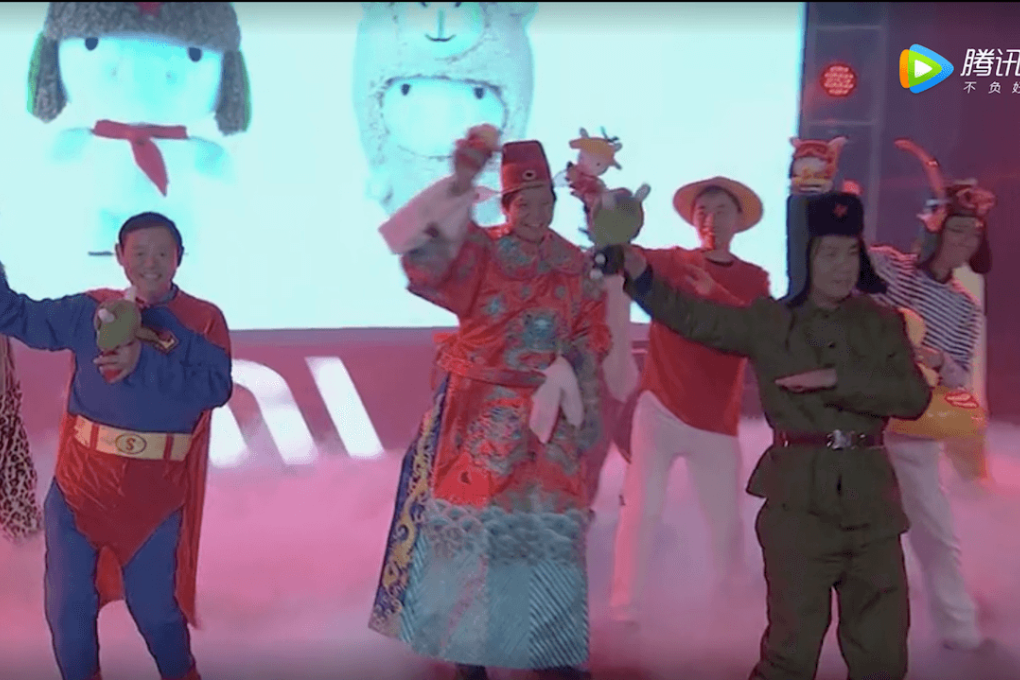 Lei (center, in red) follows the tradition of many Chinese billionaires who like to put on extravagant shows during office parties. (Picture: Xiaomi/Tencent Video)