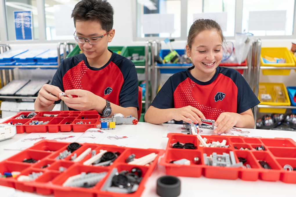 Middle School students at Stamford American School working with robotics in the Innovation Center
