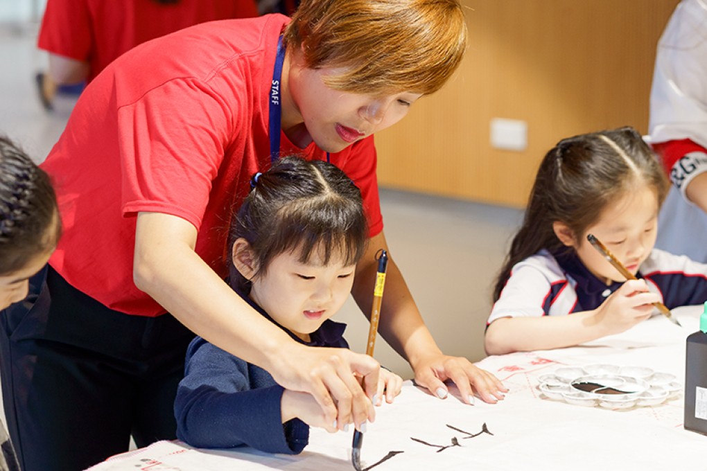 Qian Wang, Head of Mandarin at Stamford American School, teaching Chinese Calligraphy