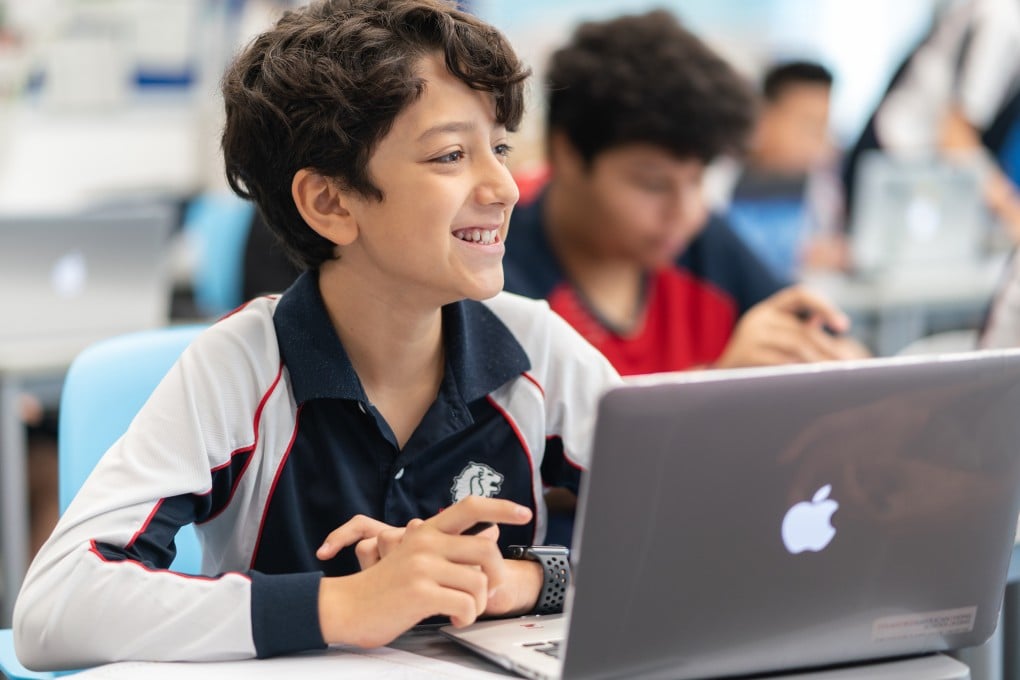 Samuel, Middle School in his classroom at Stamford American School
