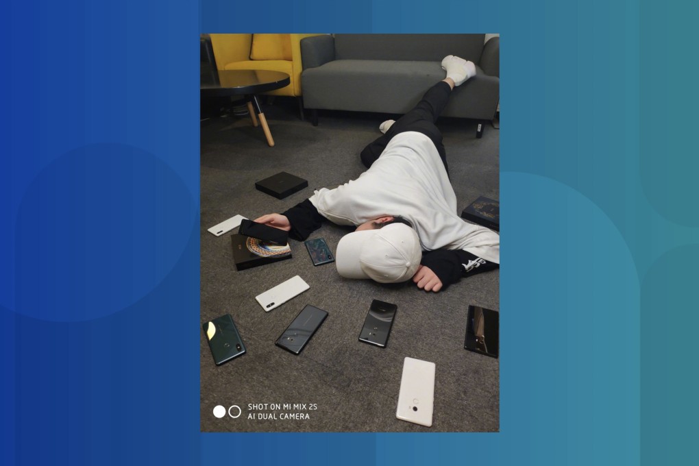 Eagle-eyed netizens spotted that this man is probably holding Xiaomi’s upcoming Mi MIX 3 flagship. (Picture: Xiaomi)