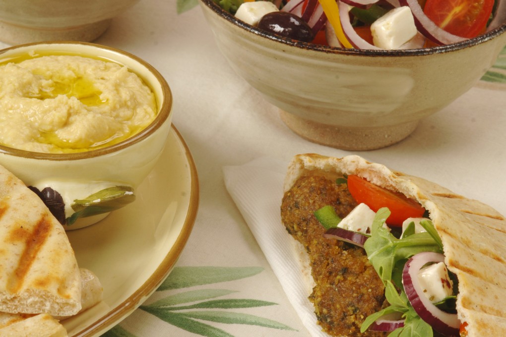 Falafel, pita bread, hummus and salad. Photo: Koji Studio