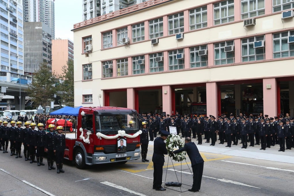 Firefighters of all ranks honour Leung Kwok-kei at the Mong Kok Fire Station. Photo: K.Y. Cheng