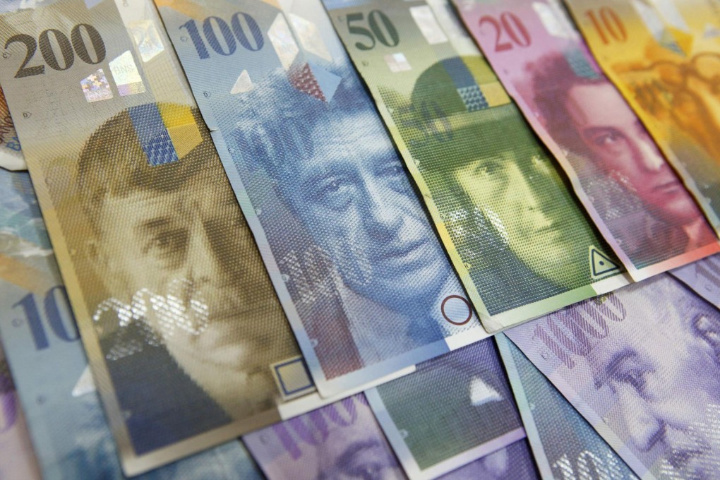 Switzerland moves to negative interest rates to cap franc's gains