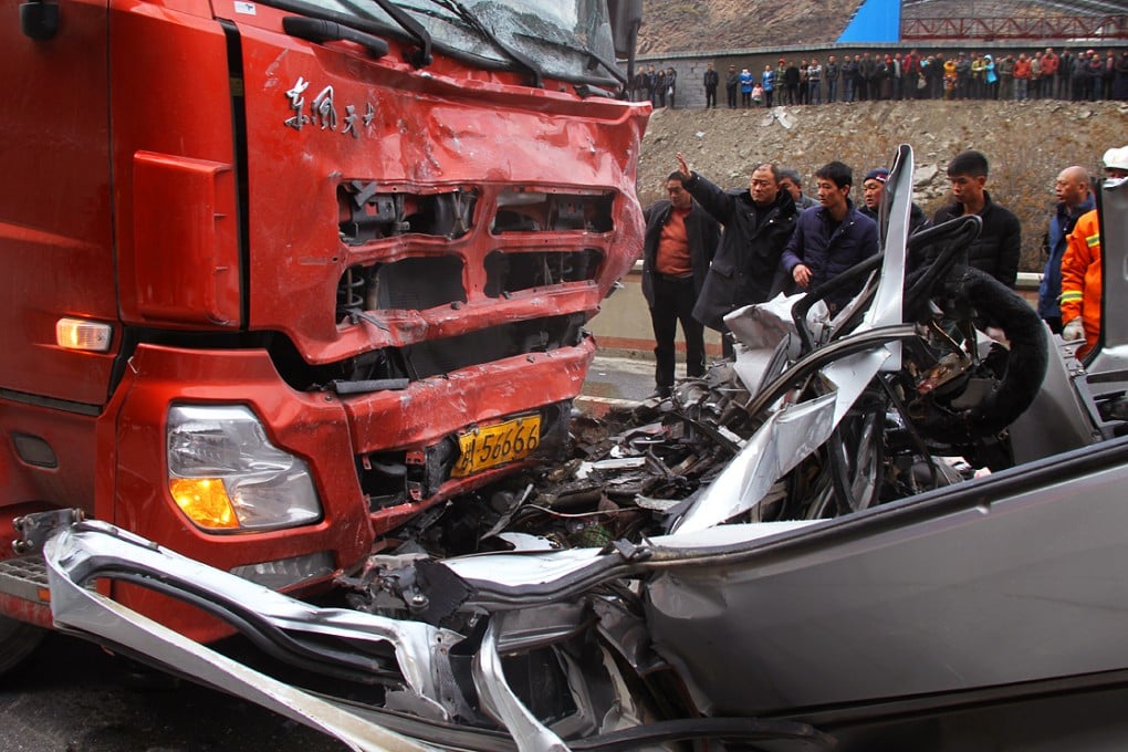 Rescuers work at the site of a road accident on State Highway. Photo: Xinhua